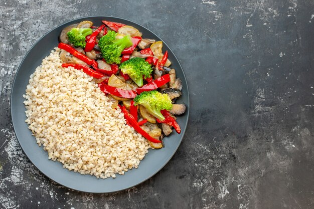 Top view cooked pearl barley with cooked with vegetables