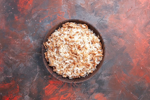 Top view cooked rice with dough slices on a dark surface dish meal dark food pasta