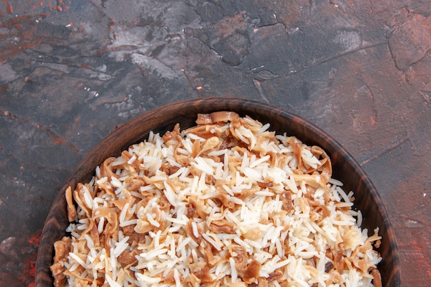 Top view cooked rice with dough slices on dark surface meal dark food pasta