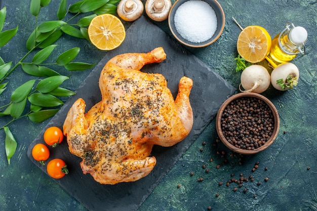 Top view cooked spiced chicken on dark surface