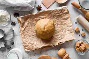 Free photo top view cookie dough on parchment paper