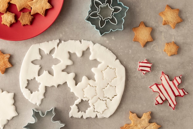 Top view of cookies dough in snowflakes shape