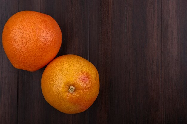 Top view  copy space oranges on wooden background