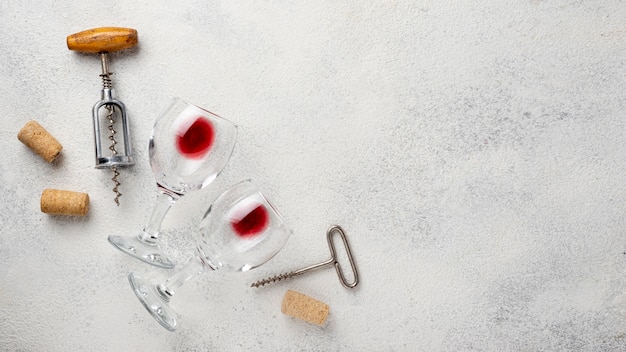 Free photo top view corkscrew and wine glasses