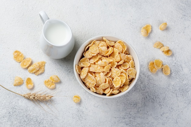 Top view of corn flakes for breakfast with milk and wheat