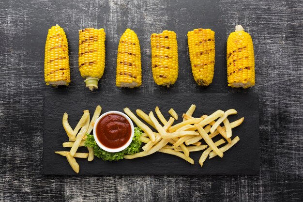 Free photo top view of corn and french fries