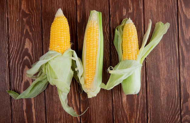 Top view of corns with shell on wood