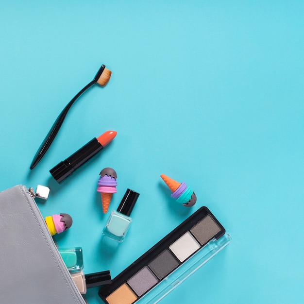 Top view of cosmetics on blue background