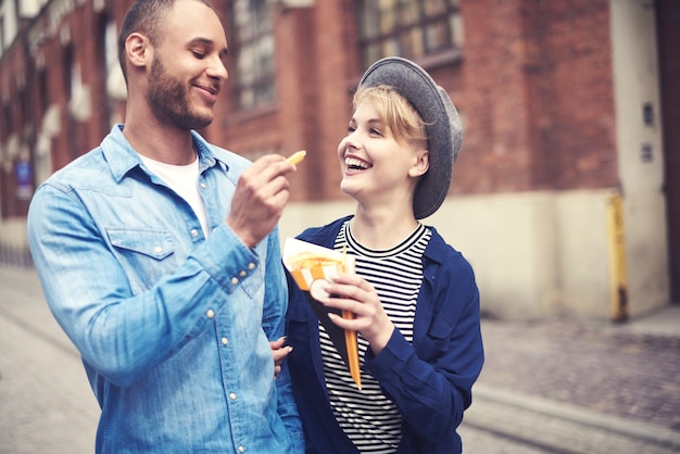 Top view of couple eating fast food