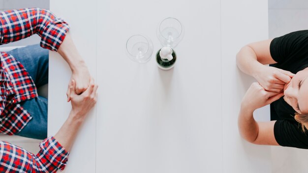 Top view of couple with wine