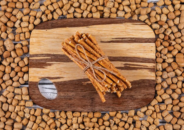 Top view of crackers on cutting board and on crackers texture horizontal