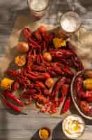 Free photo top view crawfish and corn still life