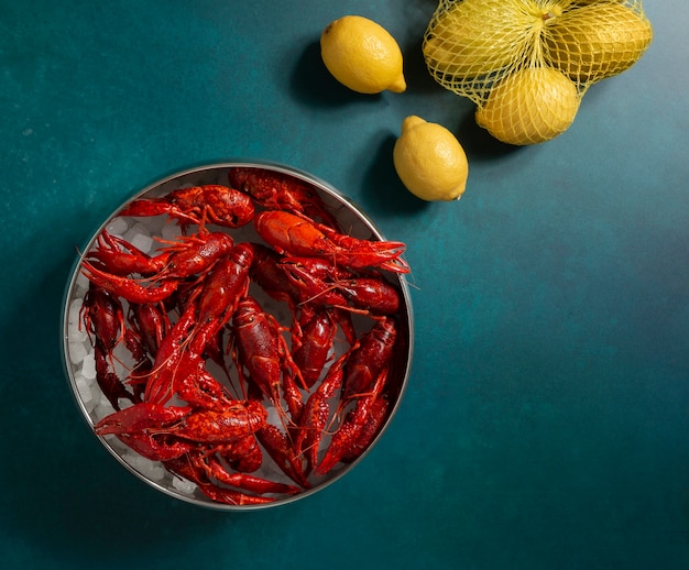 Top view crawfish and lemons still life