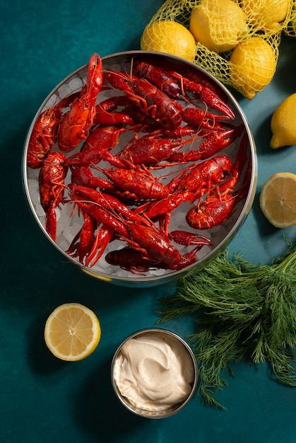 Free photo top view crawfish and lemons still life