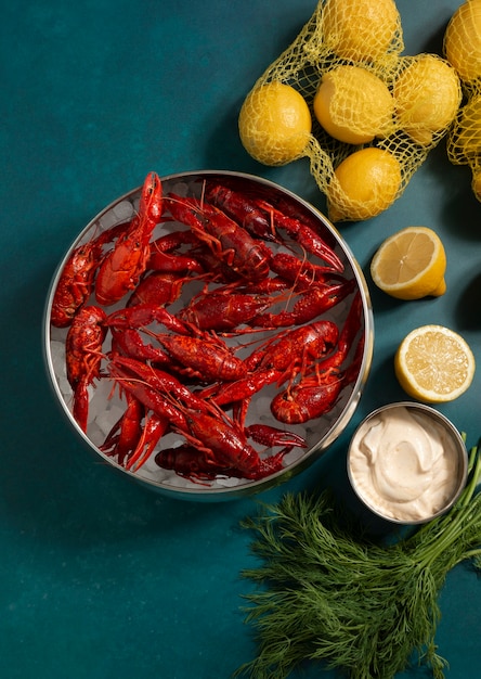 Top view crawfish and lemons still life