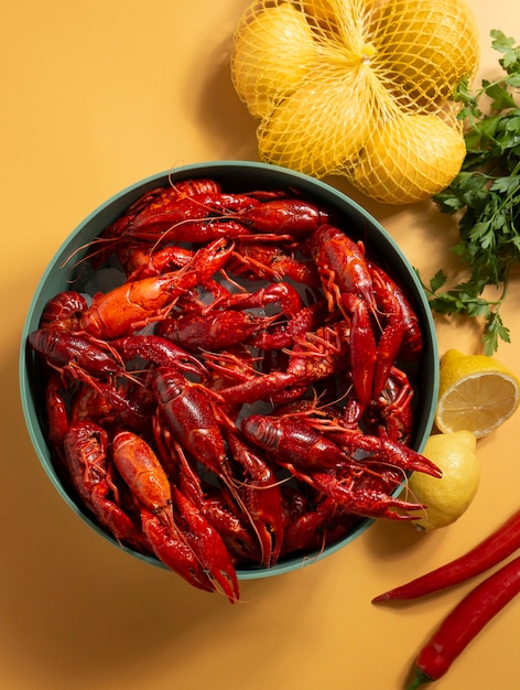 Free photo top view crawfish and lemons still life