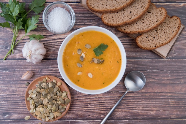 Top view cream soup with slices of bread