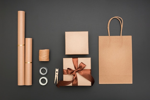 Top view creative gift wrapping composition on dark background