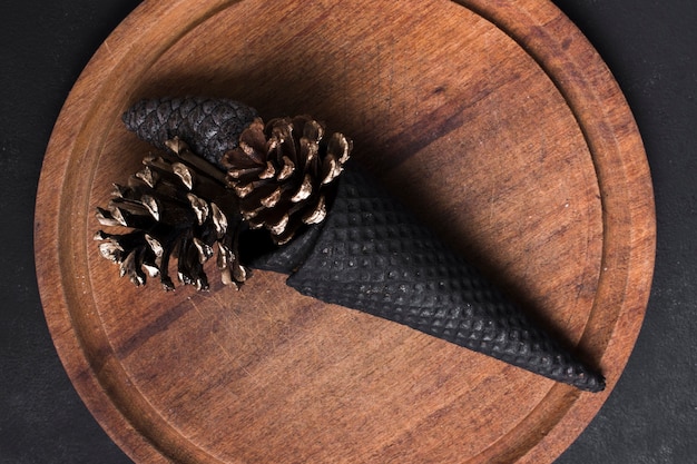 Top view creative ice cream cone with pines