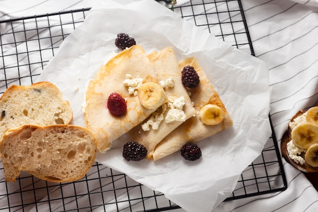 Top view crepes with mix of fruits