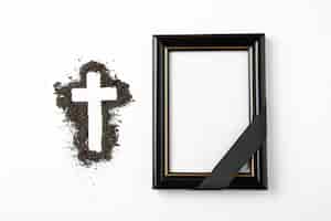 Free photo top view of cross shape with picture frame on white