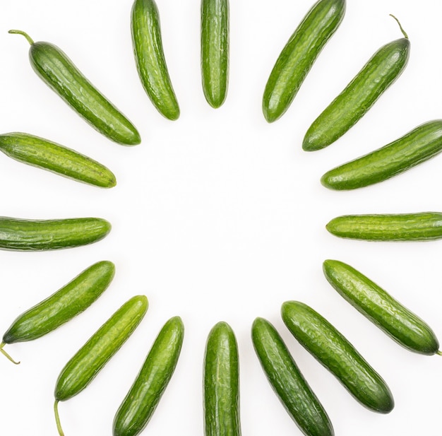 Top view cucumber with copy space in middle on white  horizontal