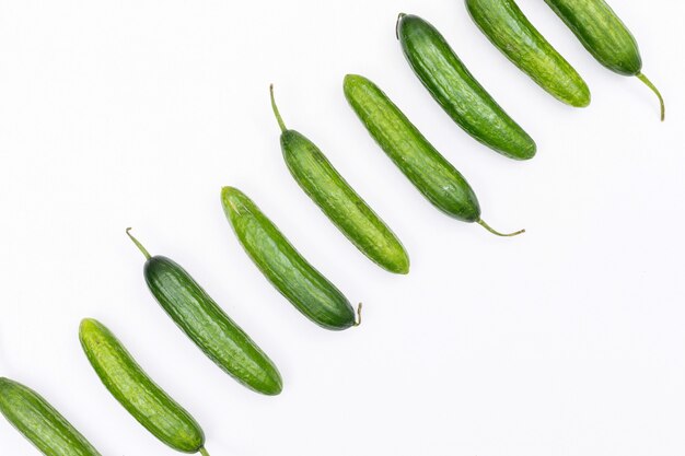 Top view cucumber with copy space on white  horizontal