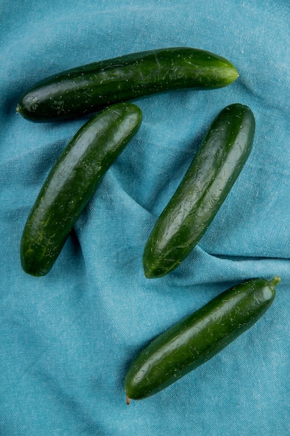 Top view of cucumbers on blue cloth