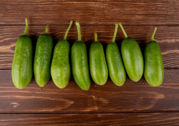 Top view of cucumbers on wooden surface