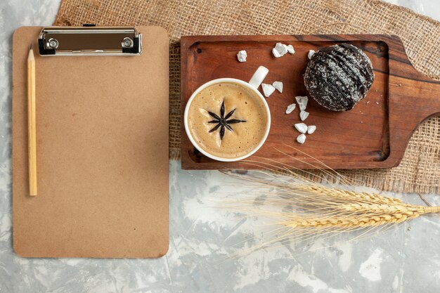 Top view cup of coffee espresso with chocolate cake on white surface chocolate cake biscuit cookies sweet