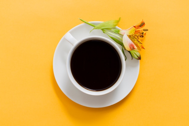 top view cup of coffee and flower