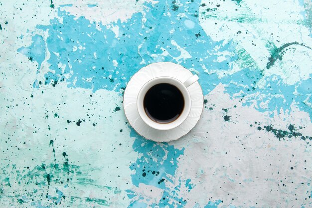 Top view cup of coffee hot and strong drink on light-blue background drink coffee cocoa sleep color photo