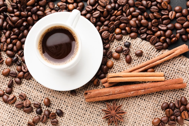 Top view cup of coffee with beans