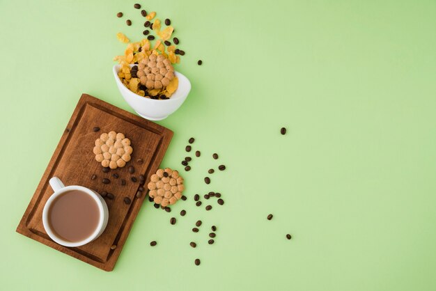 Top view cup of coffee with cookies