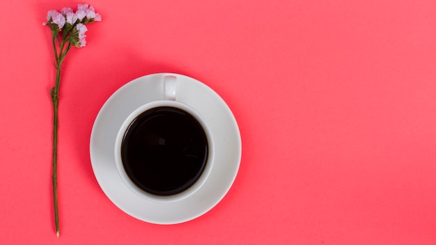 Top view cup of coffee with flower