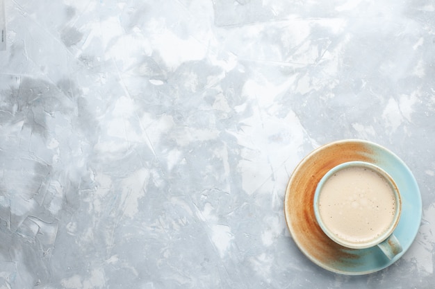 Top view cup of coffee with milk inside cup on white background drink coffee milk desk color