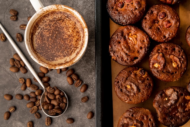 Top view cup of coffee with muffins