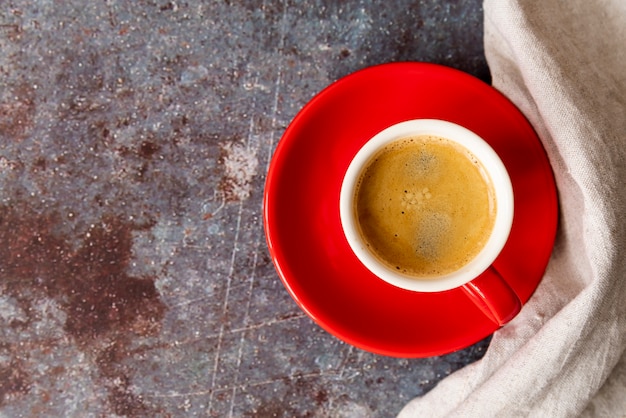 Top view cup of coffee with plate