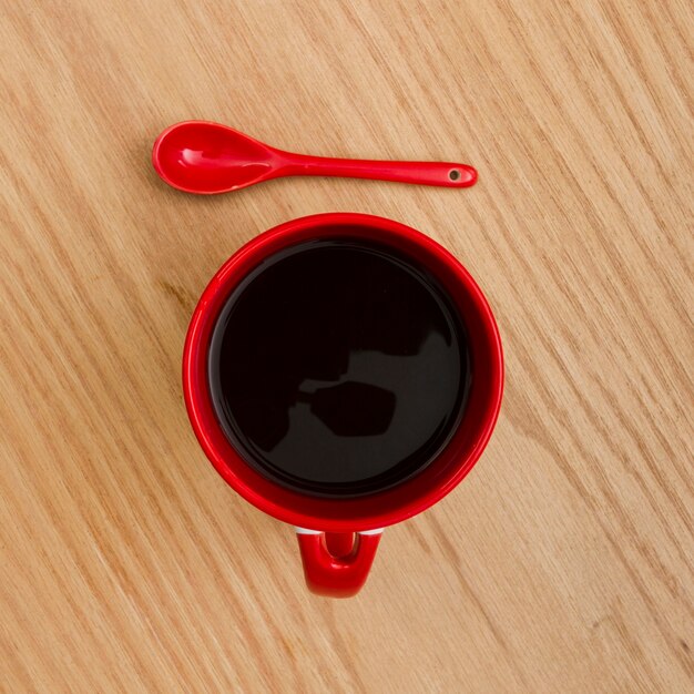 Top view cup of coffee on wooden table