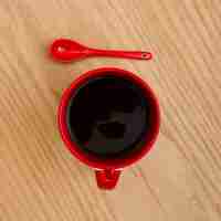 Free photo top view cup of coffee on wooden table