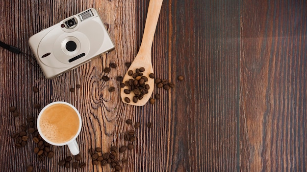 Top view cup of coffee on wooden table