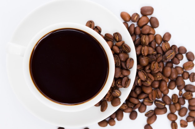 Top view cup and grains of coffee