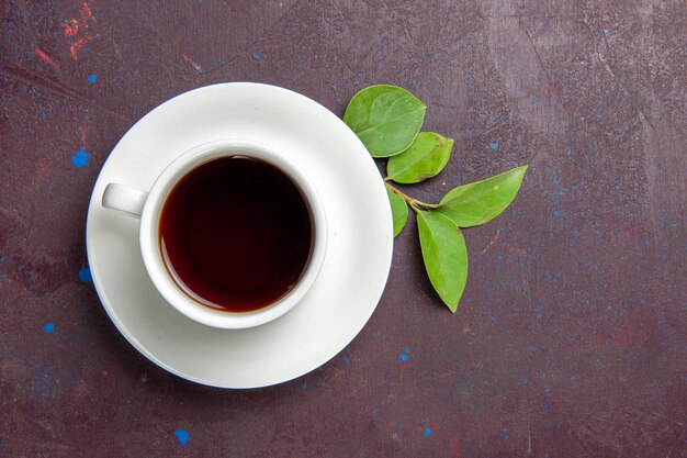 Top view cup of tea on dark space