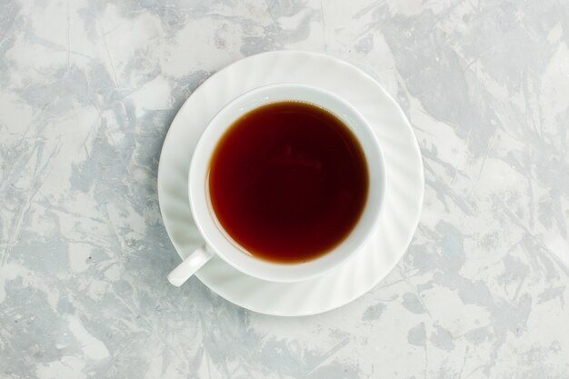 Top view cup of tea hot drink on light-white desk