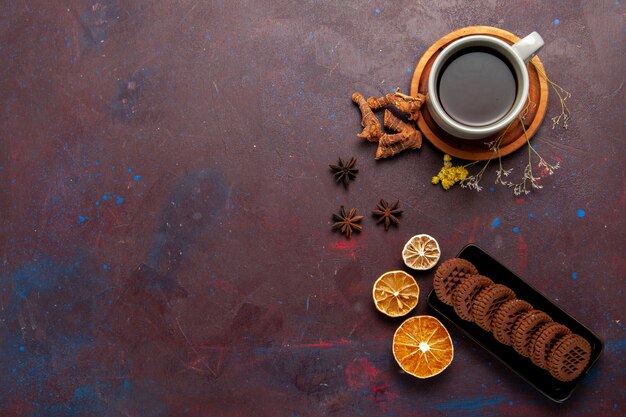 Top view cup of tea inside plate and cup on dark background tea drink color photo sweet