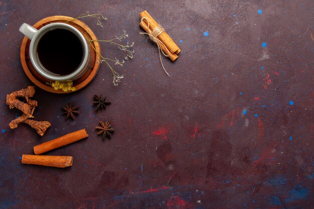 Top view cup of tea inside plate and cup on dark background tea drink color photo sweet