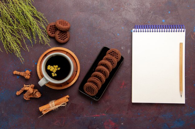 Top view cup of tea inside plate and cup on dark background tea drink color photo sweet