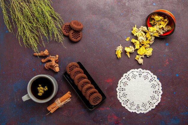 Top view cup of tea inside plate and cup on dark background tea drink color photo sweet