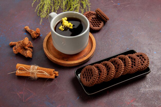 Top view cup of tea inside plate and cup on dark surface tea drink color photo sweet