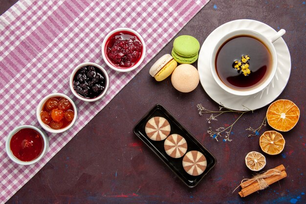 Top view cup of tea inside plate and cup on dark surface tea drink color photo sweet